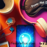 A brightly colored flat lay featuring two cups of coffee, a smartphone displaying a glowing lightbulb, a sleep mask with the words "Power Not Disturb" printed on it, pink and blue headphones, a small notebook, and a few scattered purple decorative items. The background is a vibrant orange and pink gradient.
