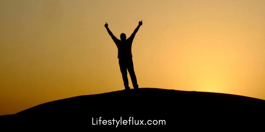 A person standing confidently with arms crossed, symbolizing self-belief and determination.